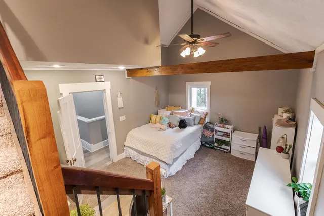 a view of a porch with wooden floor and furniture