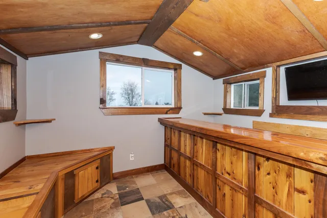 a bedroom with a bed and a view of closet