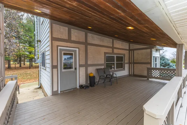 a view of chairs in wooden deck