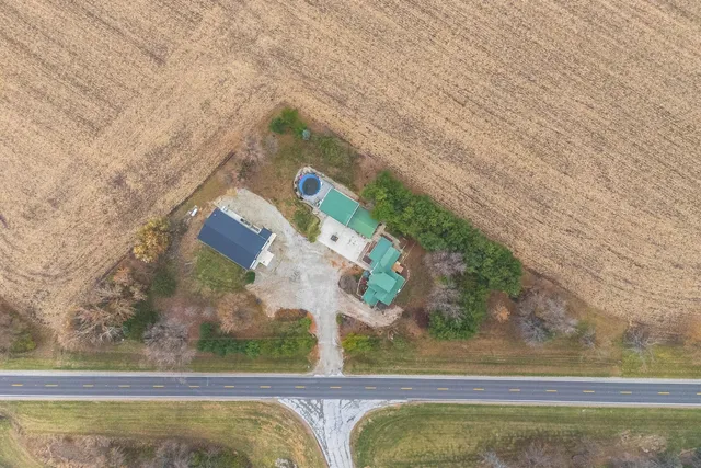 a view of a terrace with lawn chairs