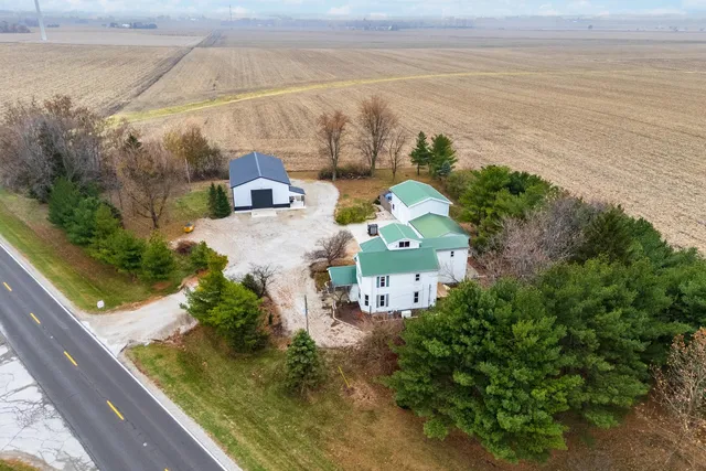 a view of a swimming pool and an outdoor seating