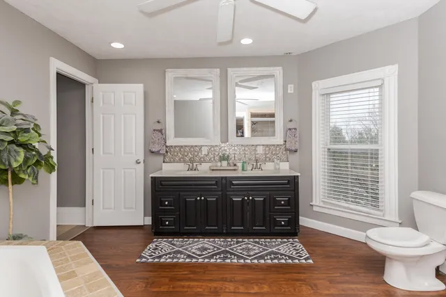 a white bath tub sitting in a bathroom