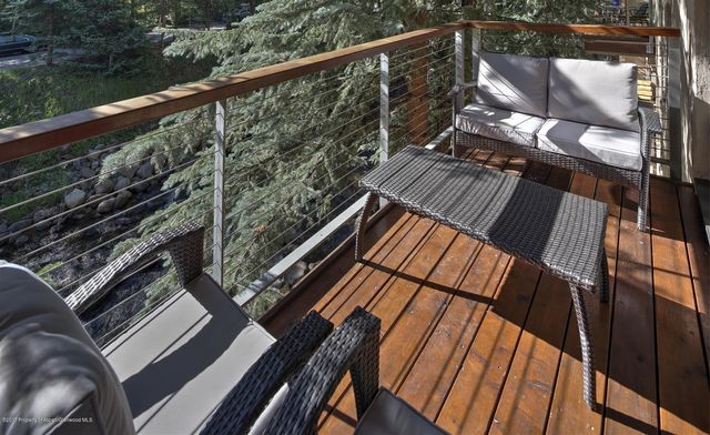 a balcony with wooden floor
