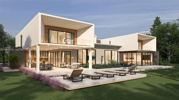 a front view of house with yard and outdoor seating