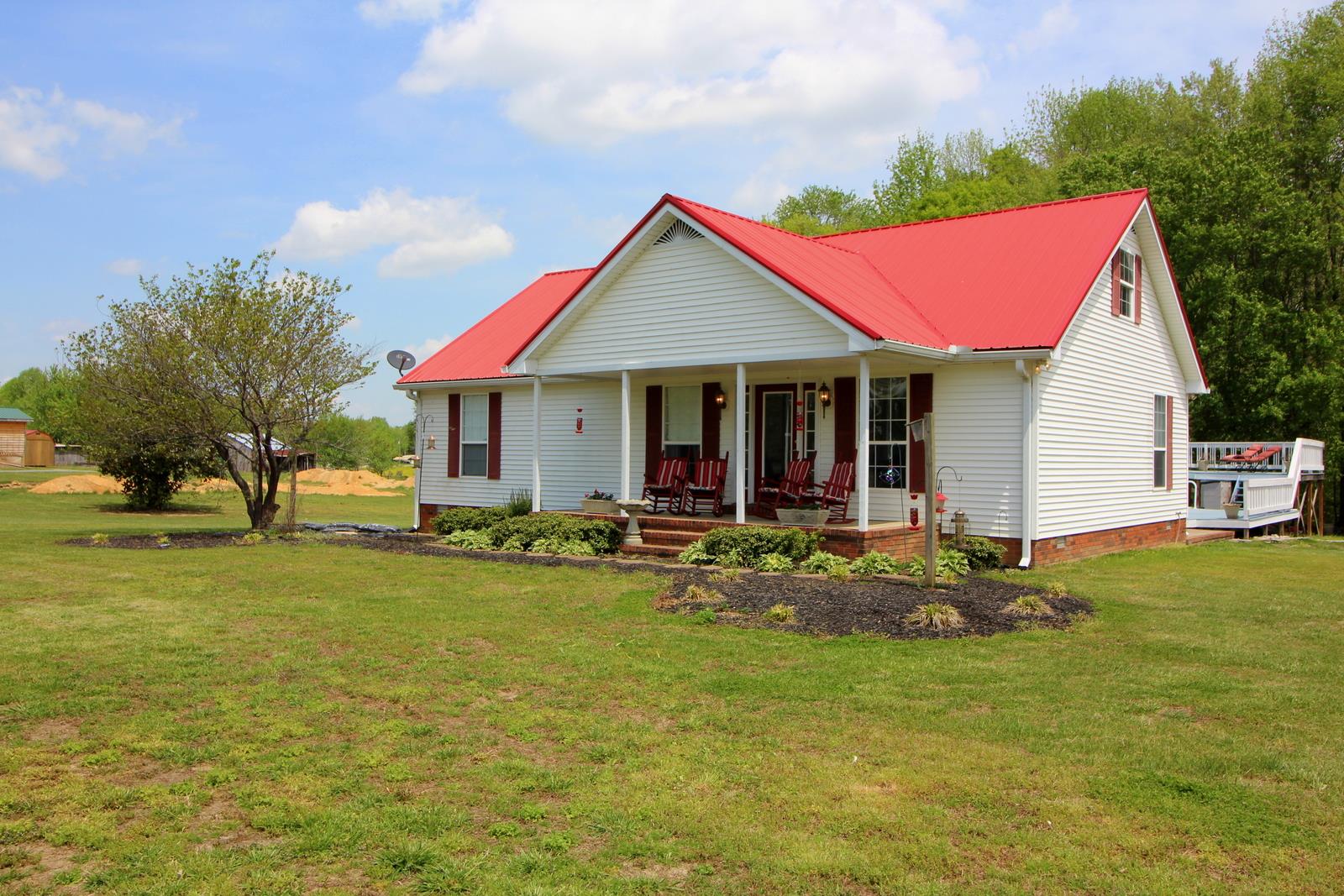 816 R B Highway Red Boiling Springs, TN 37150 - Photo 1 of 30 a view of a house with pool and chairs