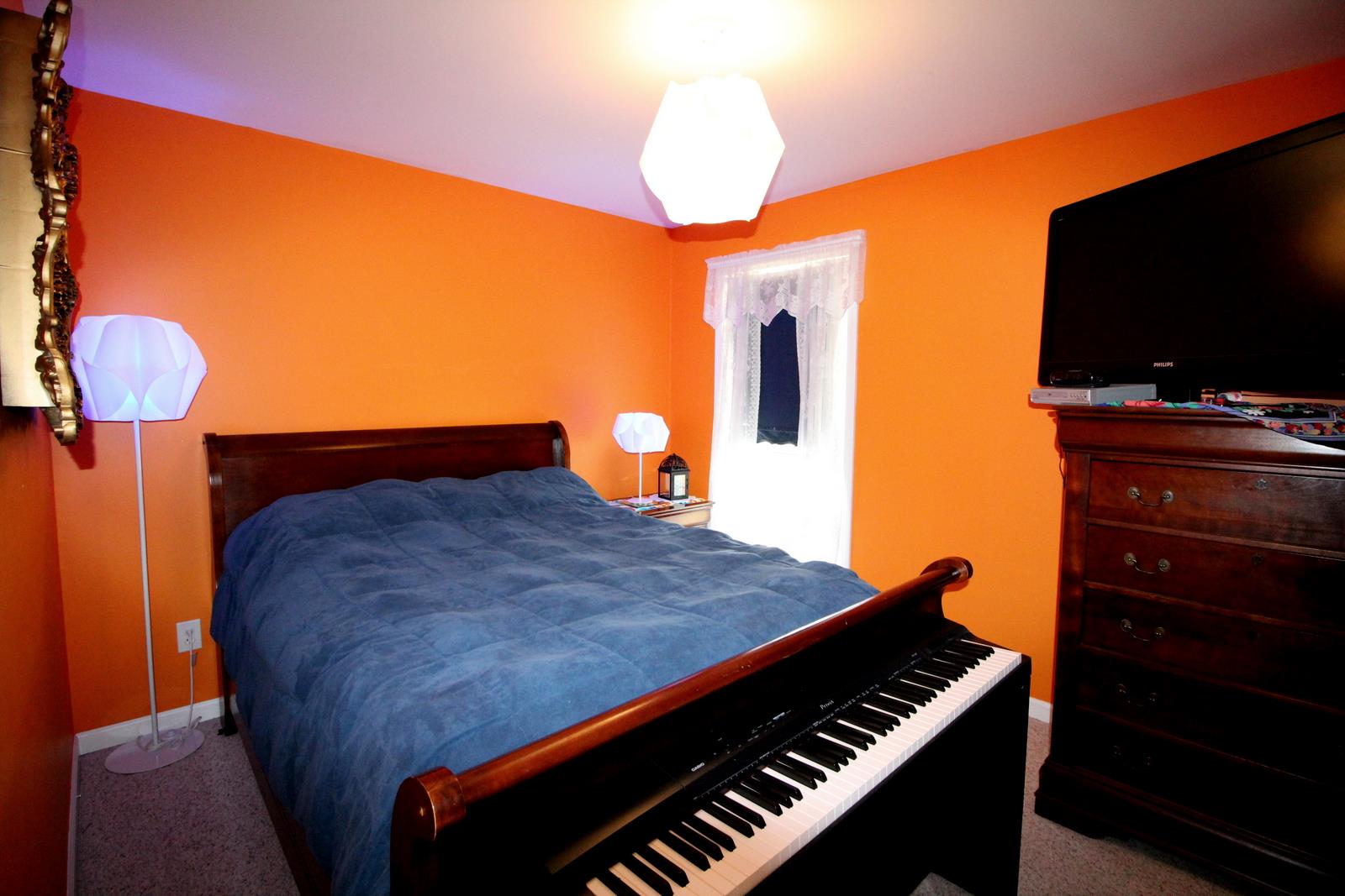 816 R B Highway Red Boiling Springs, TN 37150 - Photo 16 of 30 a bedroom with a bed and a flat screen tv
