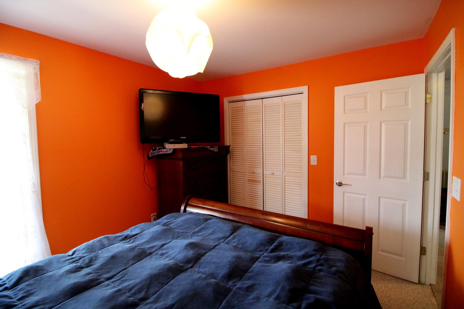 816 R B Highway Red Boiling Springs, TN 37150 - Photo 17 of 30 a bedroom with a bed and a flat screen tv