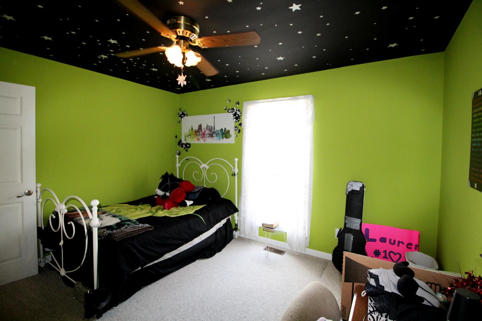 816 R B Highway Red Boiling Springs, TN 37150 - Photo 19 of 30 a bedroom with a bed and a chandelier