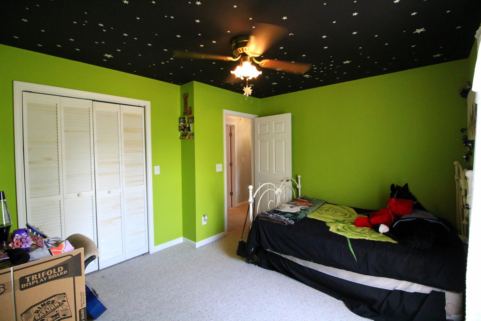 816 R B Highway Red Boiling Springs, TN 37150 - Photo 20 of 30 a bedroom with a bed and a chandelier