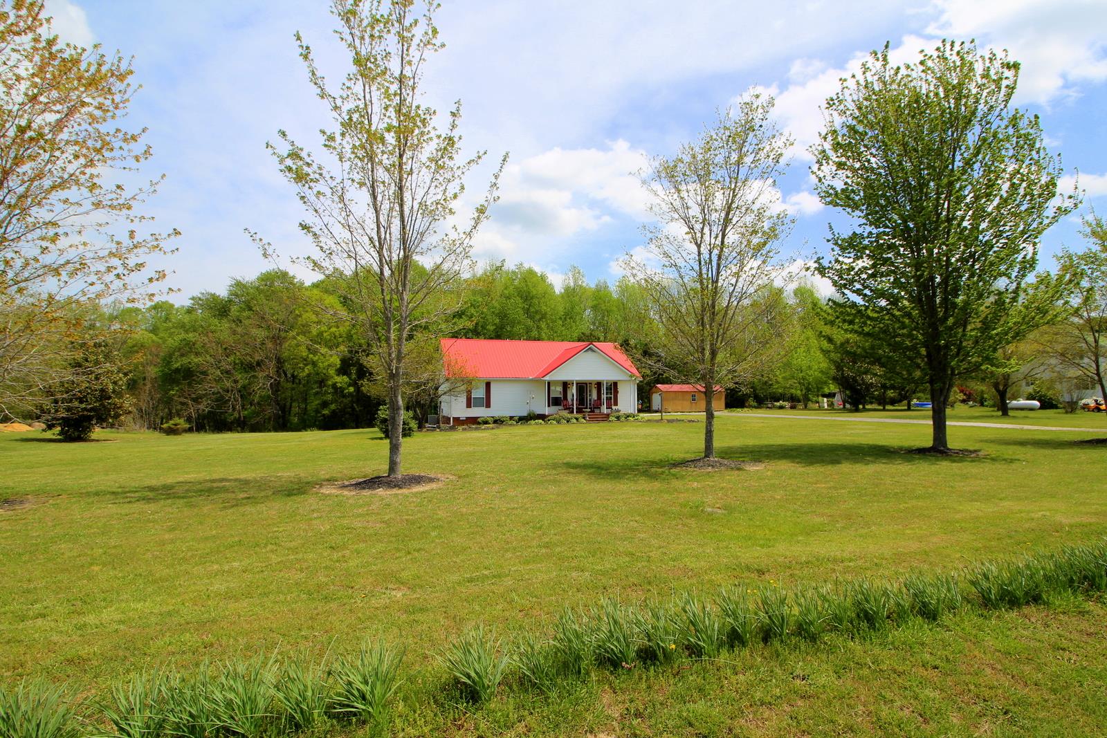 816 R B Highway Red Boiling Springs, TN 37150 - Photo 3 of 30 a house with huge green field and trees