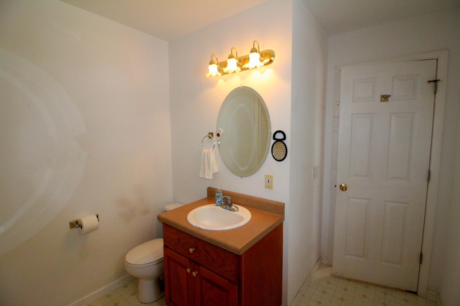 816 R B Highway Red Boiling Springs, TN 37150 - Photo 24 of 30 a bathroom with a sink and a mirror