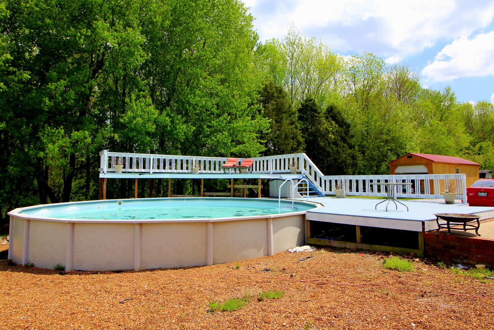 816 R B Highway Red Boiling Springs, TN 37150 - Photo 5 of 30 a view of a house with a yard deck and sitting area