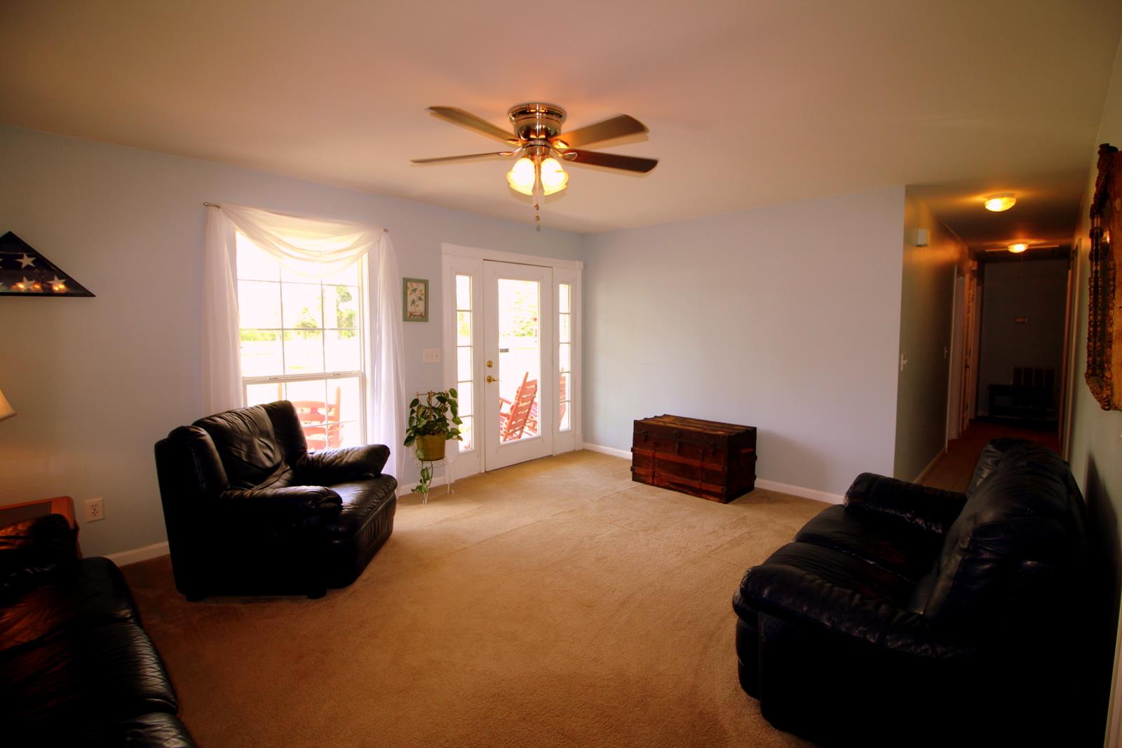 816 R B Highway Red Boiling Springs, TN 37150 - Photo 8 of 30 a living room with furniture and a flat screen tv