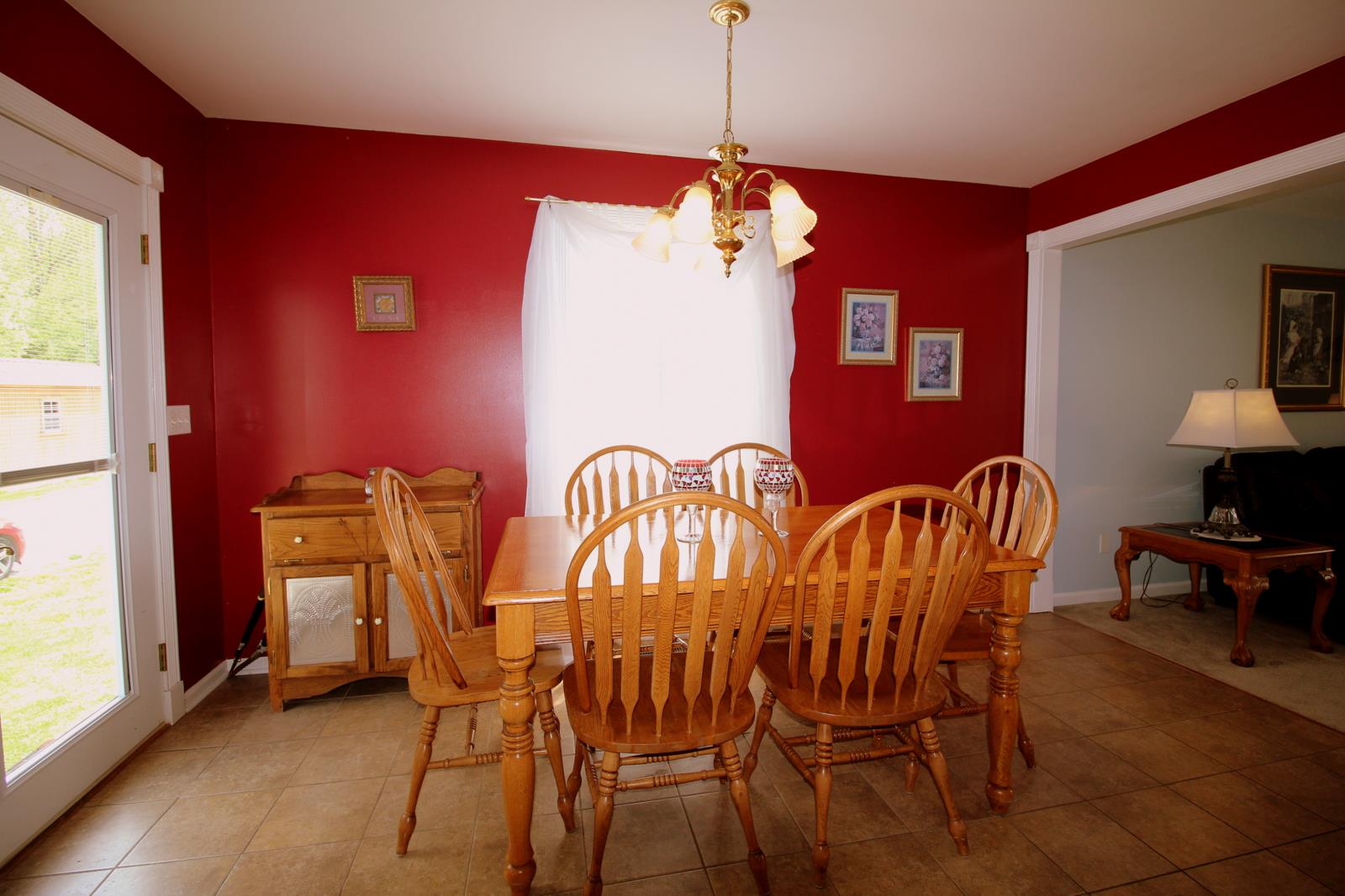 816 R B Highway Red Boiling Springs, TN 37150 - Photo 10 of 30 a view of a dining room with furniture window and wooden floor