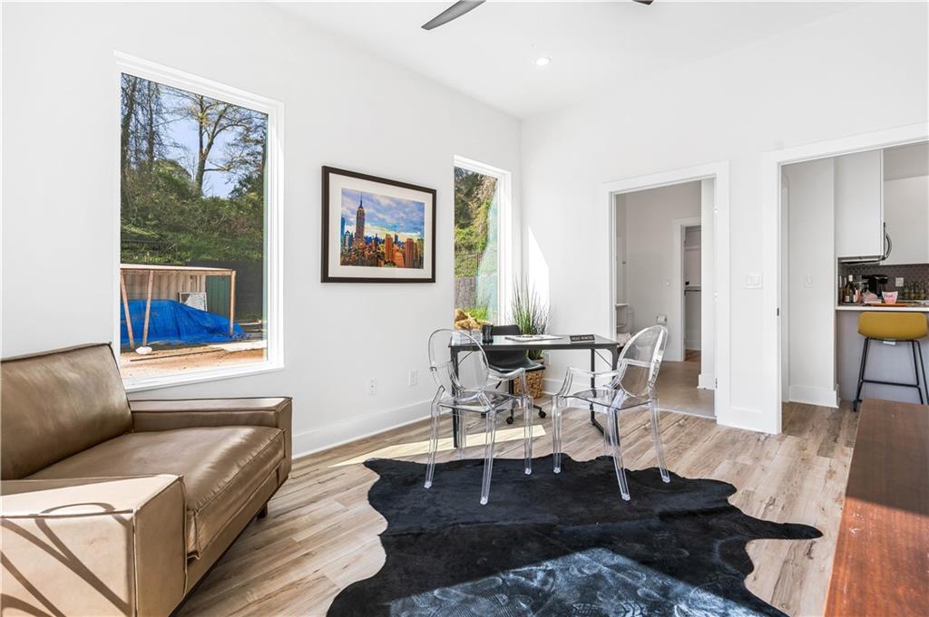 1155 Custer Avenue Southeast, Unit 202 Atlanta, GA 30316 - Photo 10 of 13 a living room with furniture a rug and a table