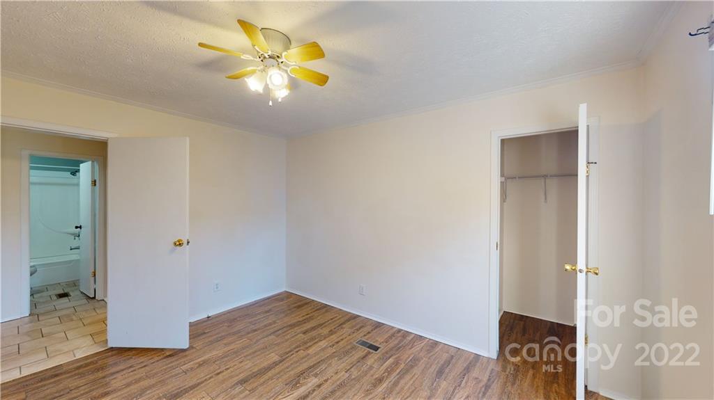 3180 Range Road Lincolnton, NC 28092 - Photo 13 of 29 a view of an empty room with wooden floor