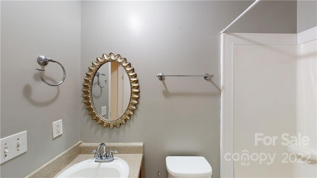 3180 Range Road Lincolnton, NC 28092 - Photo 14 of 29 a bathroom with a toilet sink and mirror
