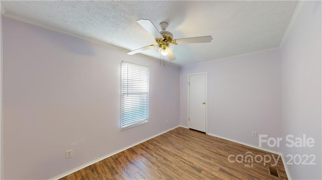 3180 Range Road Lincolnton, NC 28092 - Photo 17 of 29 a view of empty room with wooden floor and fan