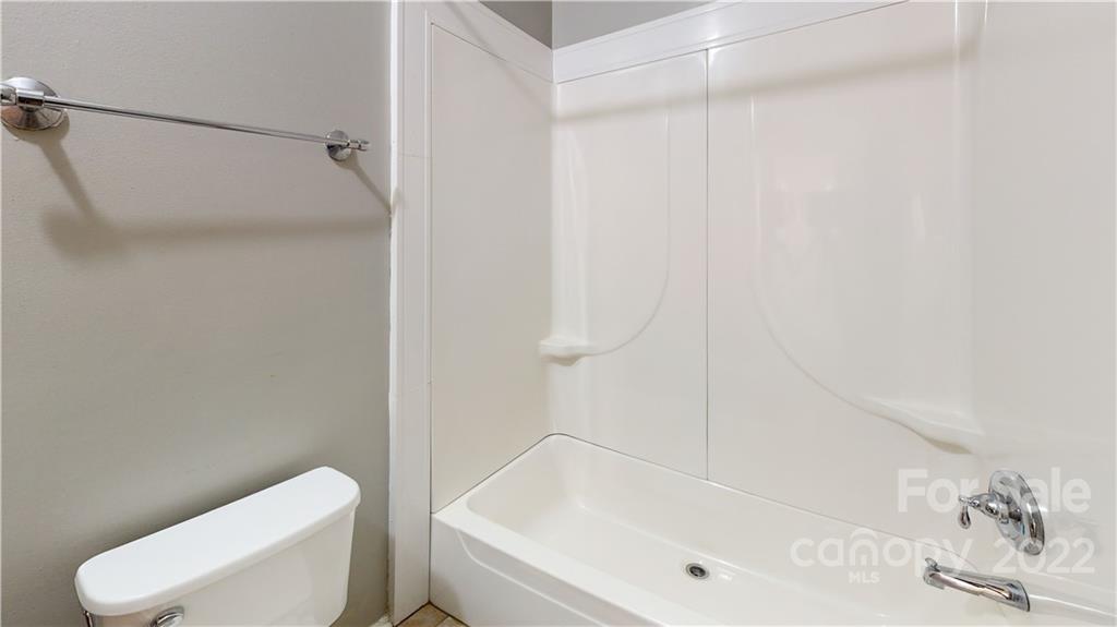 3180 Range Road Lincolnton, NC 28092 - Photo 20 of 29 a bathroom with a white toilet and a bath tub