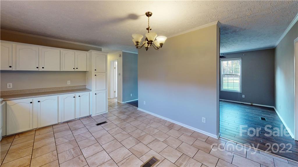 3180 Range Road Lincolnton, NC 28092 - Photo 23 of 29 a view of a kitchen with dishwasher and white cabinets