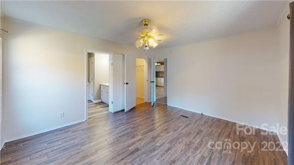 3180 Range Road Lincolnton, NC 28092 - Photo 24 of 29 a view of an empty room with wooden floor