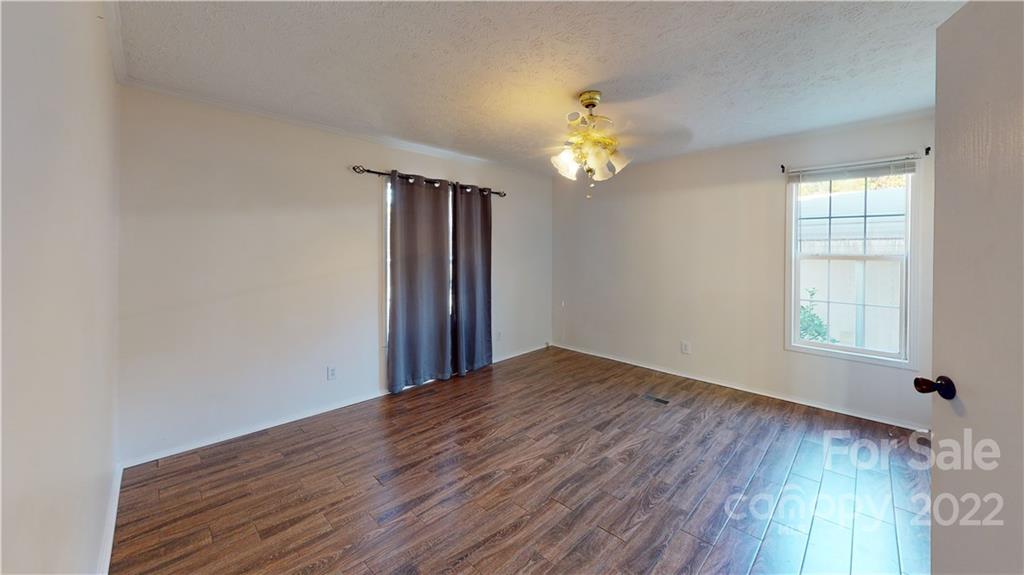 3180 Range Road Lincolnton, NC 28092 - Photo 25 of 29 an empty room with wooden floor and window