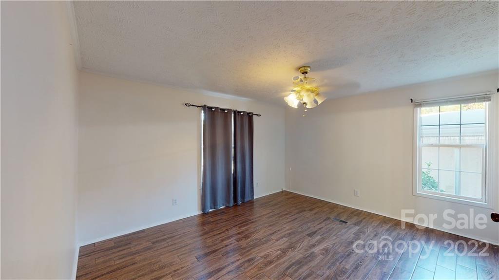 3180 Range Road Lincolnton, NC 28092 - Photo 5 of 29 a view of empty room with wooden floor and fan
