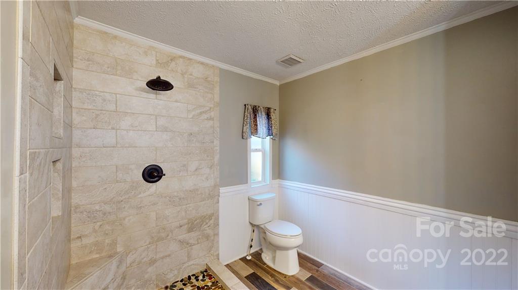 3180 Range Road Lincolnton, NC 28092 - Photo 7 of 29 a bathroom with a toilet and a shower