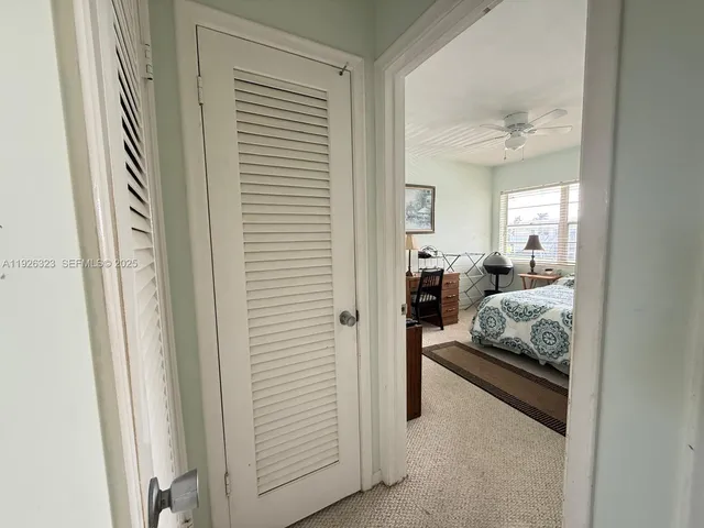 a bathroom with a sink mirror toilet and bathtub