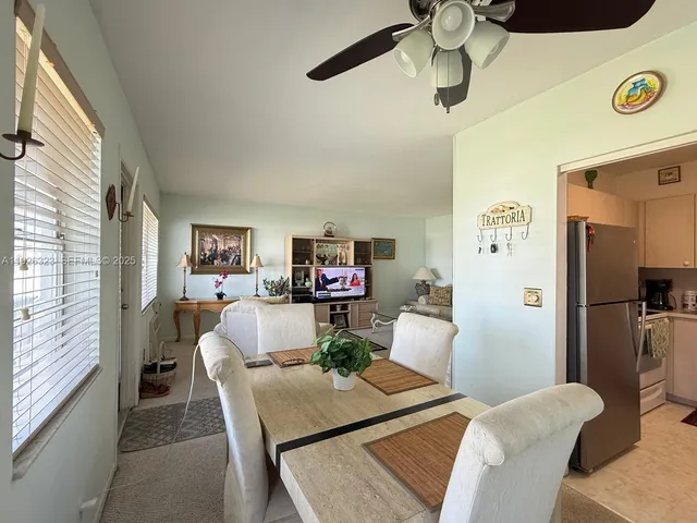 a view of a kitchen with a sink and cabinets