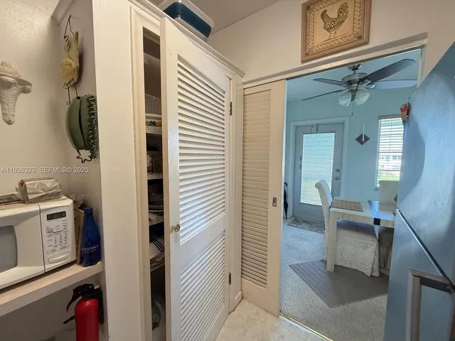 a kitchen with cabinets appliances and a counter space