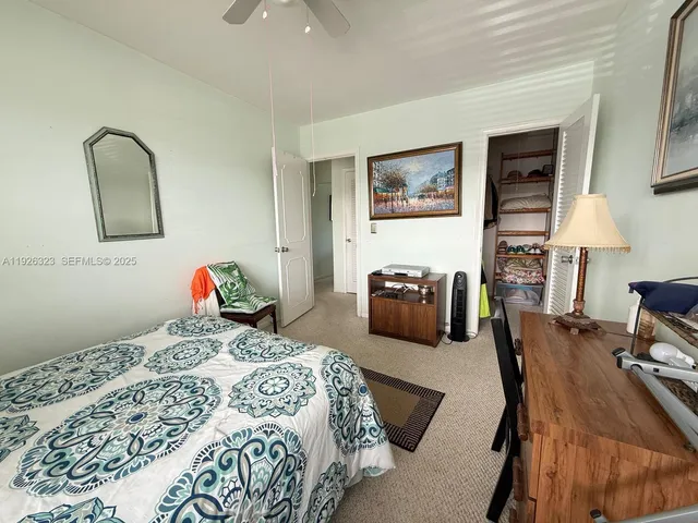 a bedroom with bed and window