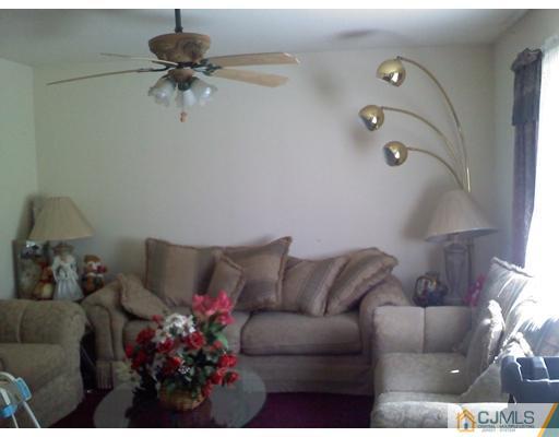 74 Ashley Road Edison, NJ 08817 - Photo 3 of 10 a living room with furniture and a couch