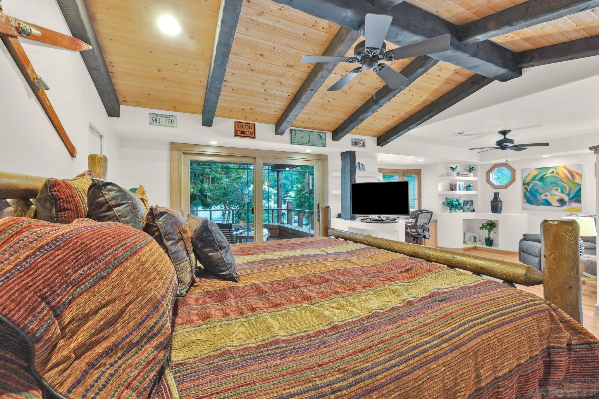 1695 Calmin Way Fallbrook, CA 92028 - Photo 27 of 44 a bed sitting in a bedroom next to a window with a flat screen tv