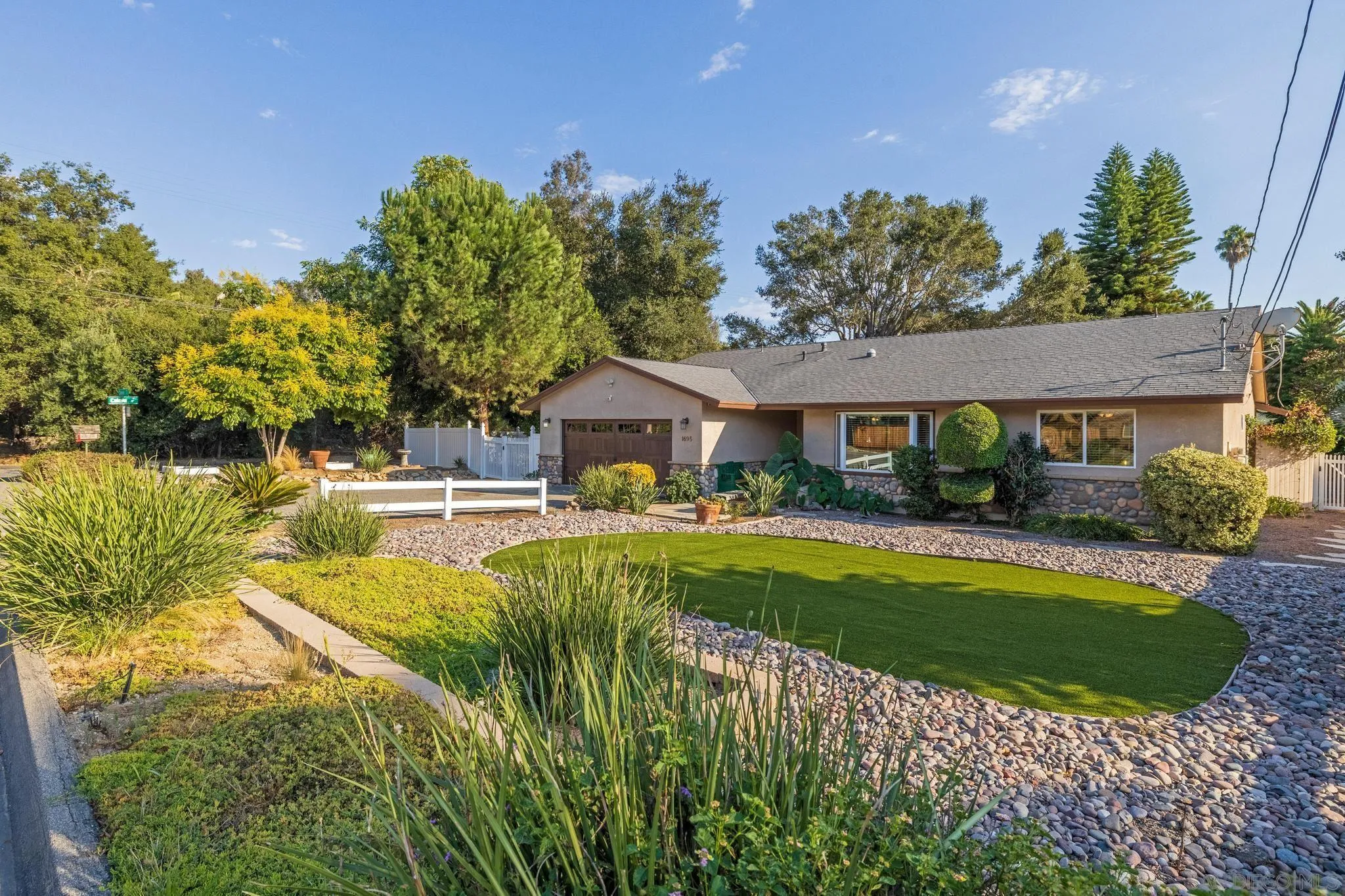 1695 Calmin Way Fallbrook, CA 92028 - Photo 3 of 44 a house view with swimming pool and garden space