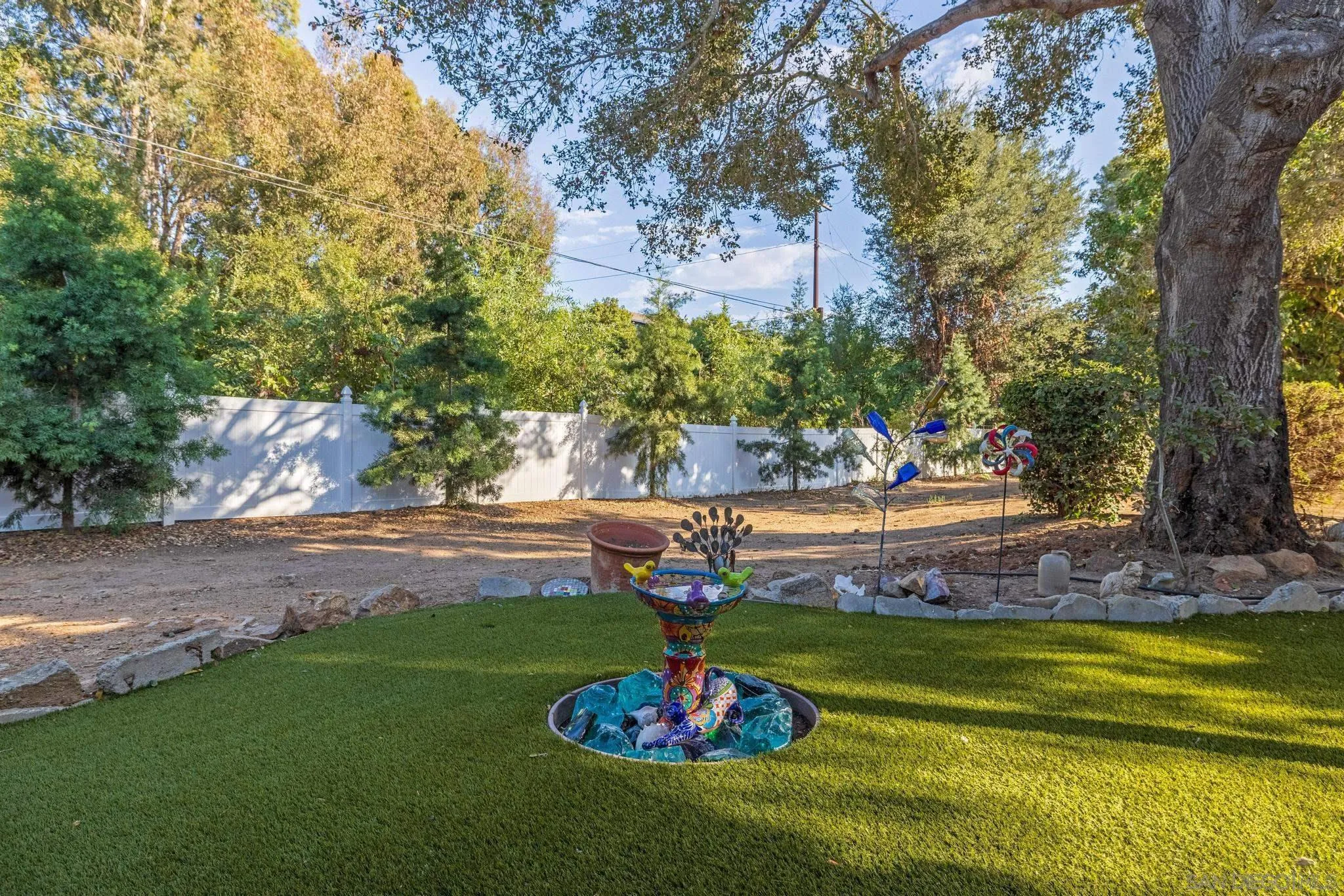 1695 Calmin Way Fallbrook, CA 92028 - Photo 6 of 44 a view of a swimming pool with an outdoor space and seating area