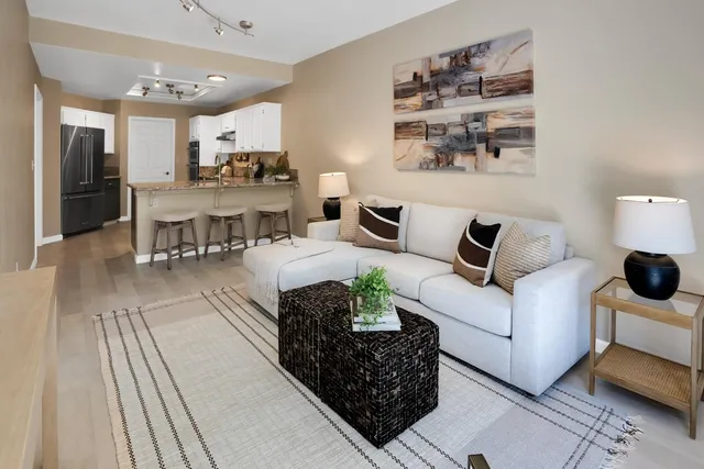 a living room with furniture and a table