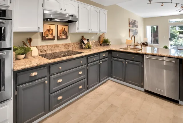 a kitchen with a sink and cabinets