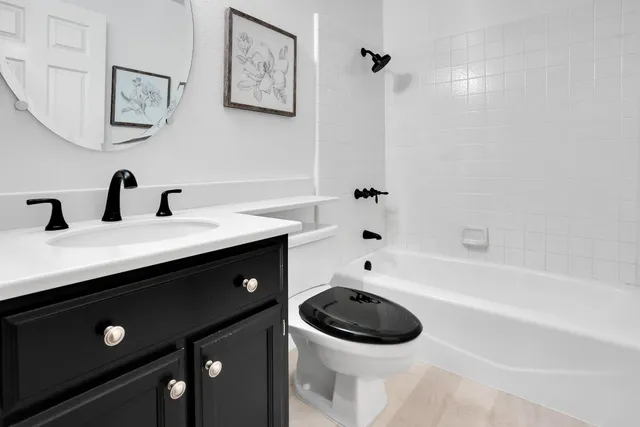 a bathroom with a sink a toilet and a bathtub