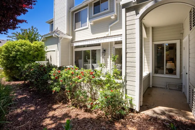 a front view of a house with a garden