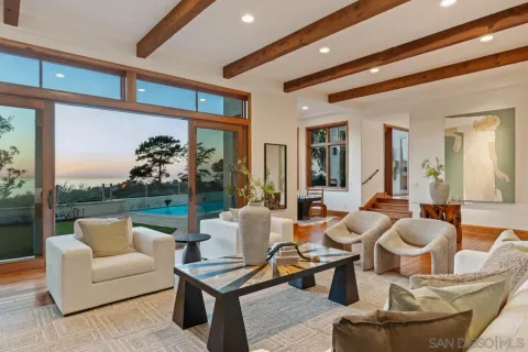 a kitchen with a stove sink and cabinets