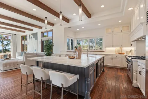 a living room with patio fireplace furniture and a flat screen tv