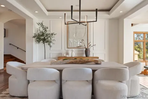 a large bathroom with a large tub sink vanity and a large mirror