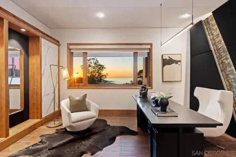 a view of a house with backyard porch and sitting area