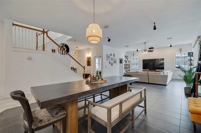 a kitchen with stainless steel appliances a sink stove and refrigerator