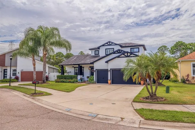 a front view of house with yard and green space