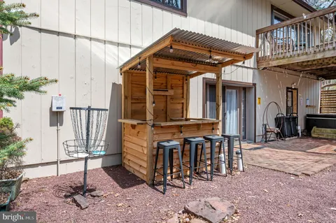 a view of a chair and table in the patio