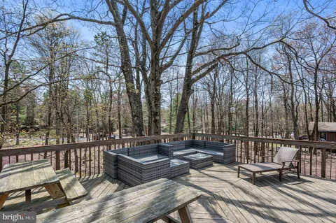 a view of a chairs in wooden deck