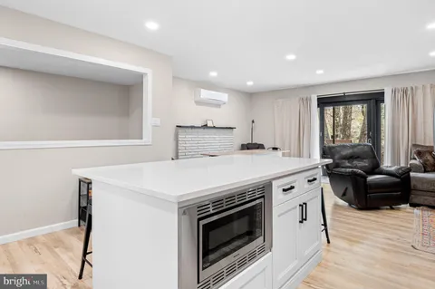 a kitchen with a stove a sink and a refrigerator