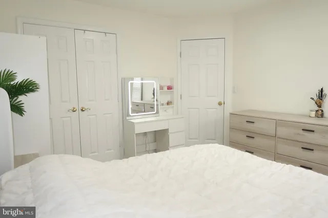 a bedroom with a bed and a closet